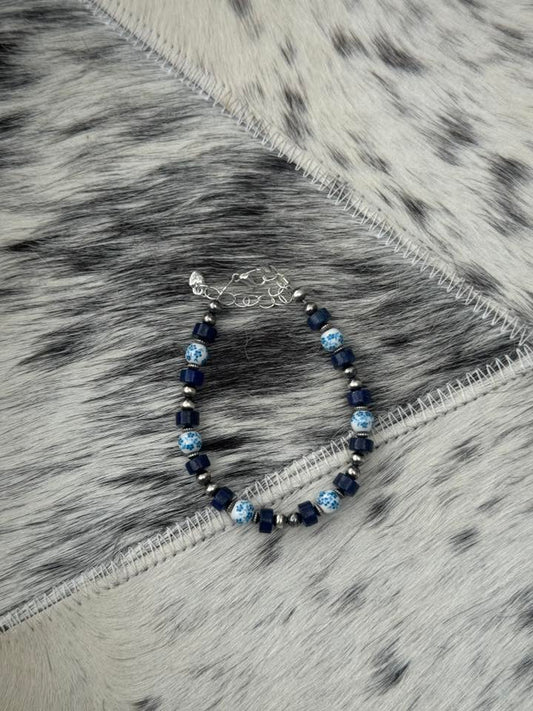 7-8.5" 4mm Pearl, 3mm Corrugate Saucer w/ Blue Lapis & Floral China Bracelet